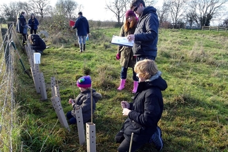 Volunteers of all ages socially distanced tree planting!