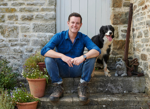 Matt Baker MBE with dog sat on step
