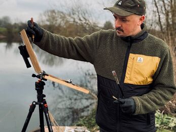Martin Wright working on a painting outdoors