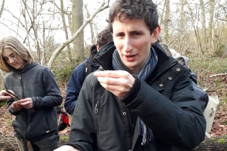 Alex Duncan with a handful of dormice nibbled hazelnuts