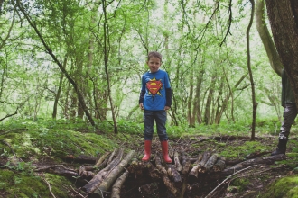 Edward stands on a pile of branches