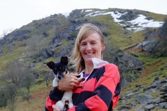 Emma with her dog in the hills