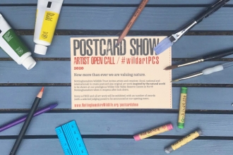Postcard Show Artist Open call flyer surrounded by paintbrushes, pencils and paints