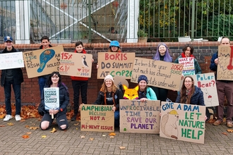 Keeping it Wild Youth Team members and Nottinghamshire Wildlife Trust Staff holding placards at the Nottingham Climate March
