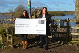 A cheque presentation from John Lewis to fundriaising officer Sienna Carver at Attenborough Nature Reserve