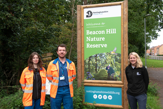 Emily Patrick of Nottinghamshire Wildlife Trust (right) with Adam Garbutt and Jenny Jones from Formula at the new Beacon Hill sign