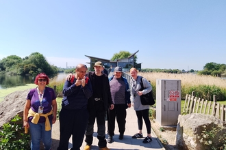 Volunteer group photo outside Attenborough Nature Centre