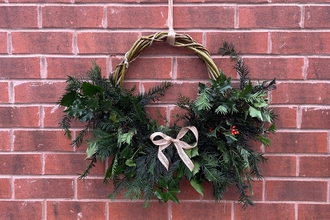 Eco-friendly christmas wreath hung on wall