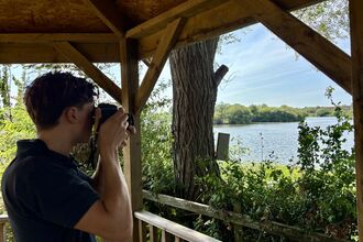 Man taking photo of nature from a sheltered area