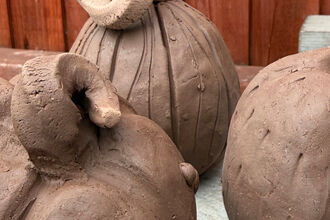 Clay pumpkins on display