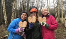 Skylarks volunteers holding wooden hearts