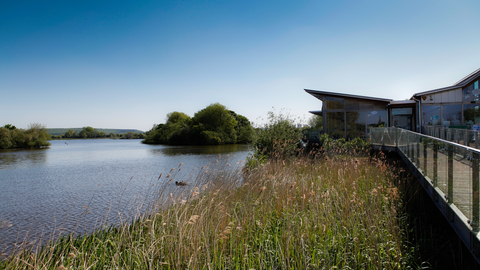A view of Attenborough nature centre and reserve from the end of the walkway