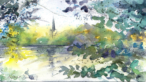 Church steeple by lake and trees