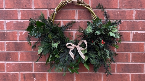 Eco-friendly christmas wreath hung on wall