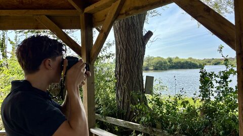 Man taking photo of nature from a sheltered area