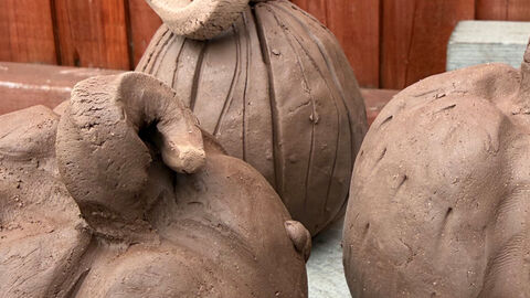 Clay pumpkins on display