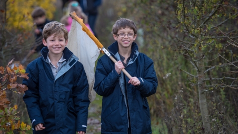 Children with net on winter walk