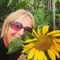 Woman smiling with sunflower