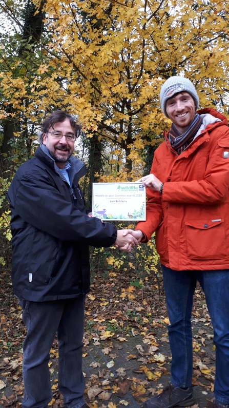 Jack (right) being presented with his Wildlife on Your Doorstep certificate by Nottinghamshire Wildlife Trust’s Head of Communications Erin McDaid.