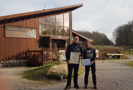 Holly McCain presenting Forest Holidays General Manager, Ben Orton with certificates