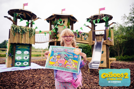 Lottie Brown in front of her treehouse design at Idle Valley Nature Reserve