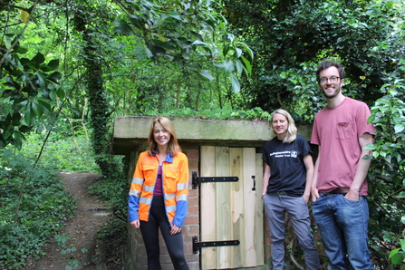 Amy Everton, Emily Patrick and David Griffiths standing in front of bat hotel