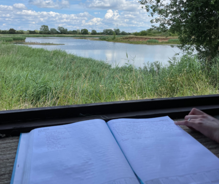 Log book with bird species in a bird hide