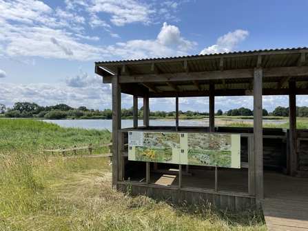 A bird hide with a wetland view