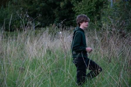 boy in long grass