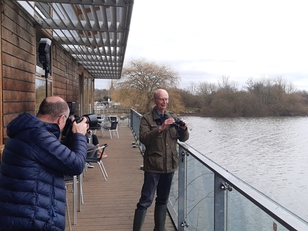 Geoffrey Marshall birdwatching at Attenborough Nature Centre for a photoshoot with RNID