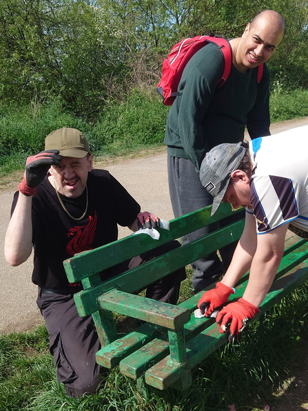 MJC Volunteers cleaning a bench at Attenborough