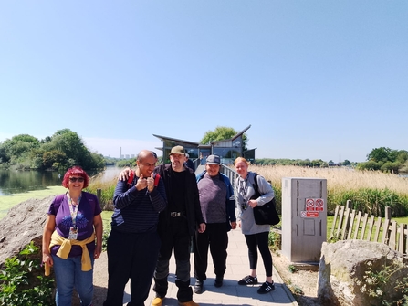 Volunteer group photo outside Attenborough Nature Centre
