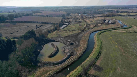 Aerial view of ponds near river