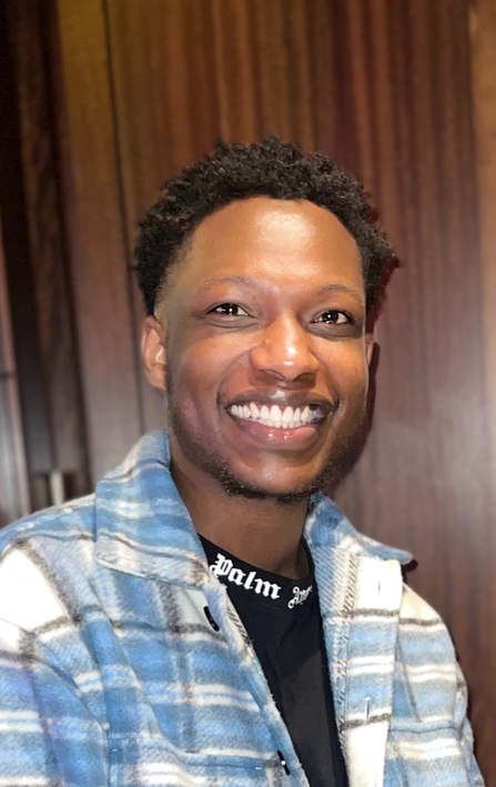 Naftal Zinyemba smiling at the camera