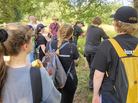 Young volunteers at sherwood forest listening to Michael Walker on nature recovery