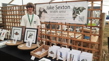 Jake Sexton at a stall with his wildlife artwork