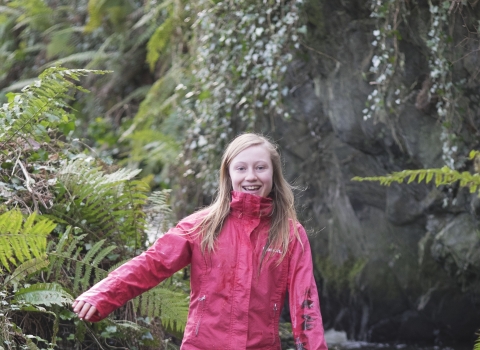 Molly stands in a stream