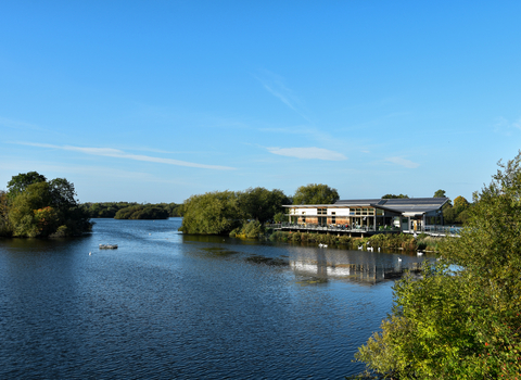 A view of Attenborough Nature Centre and Coneries Pond