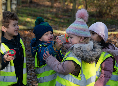 children playing in woodland