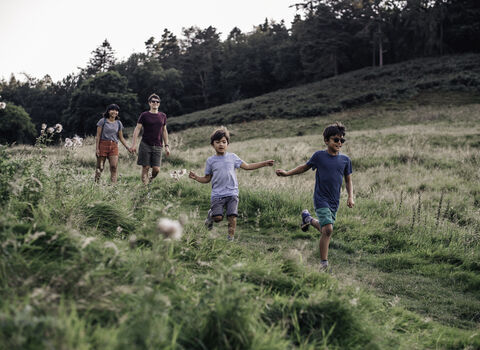 A family running through a field